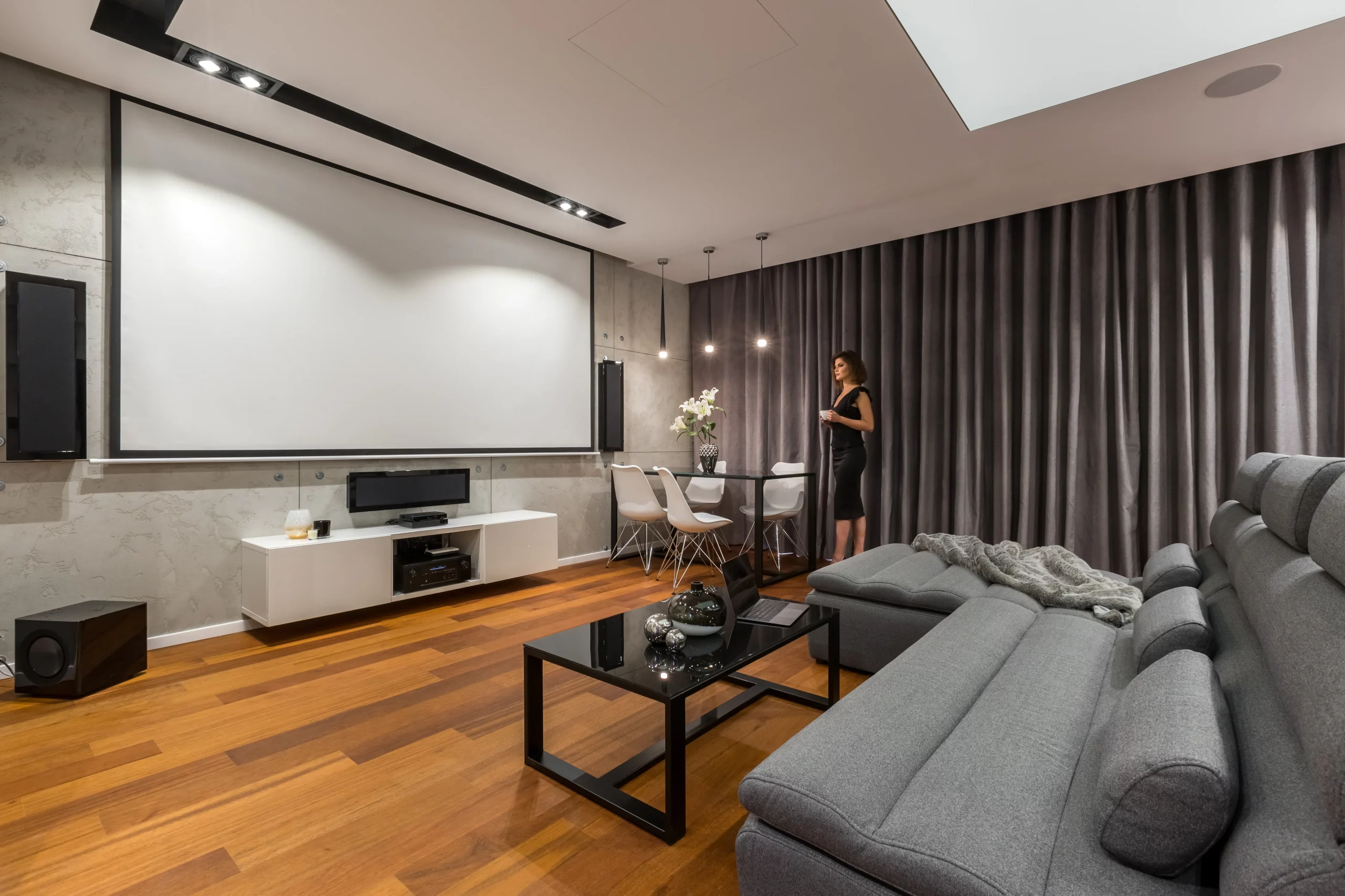 Modern living room home theater with large screen and hidden speakers